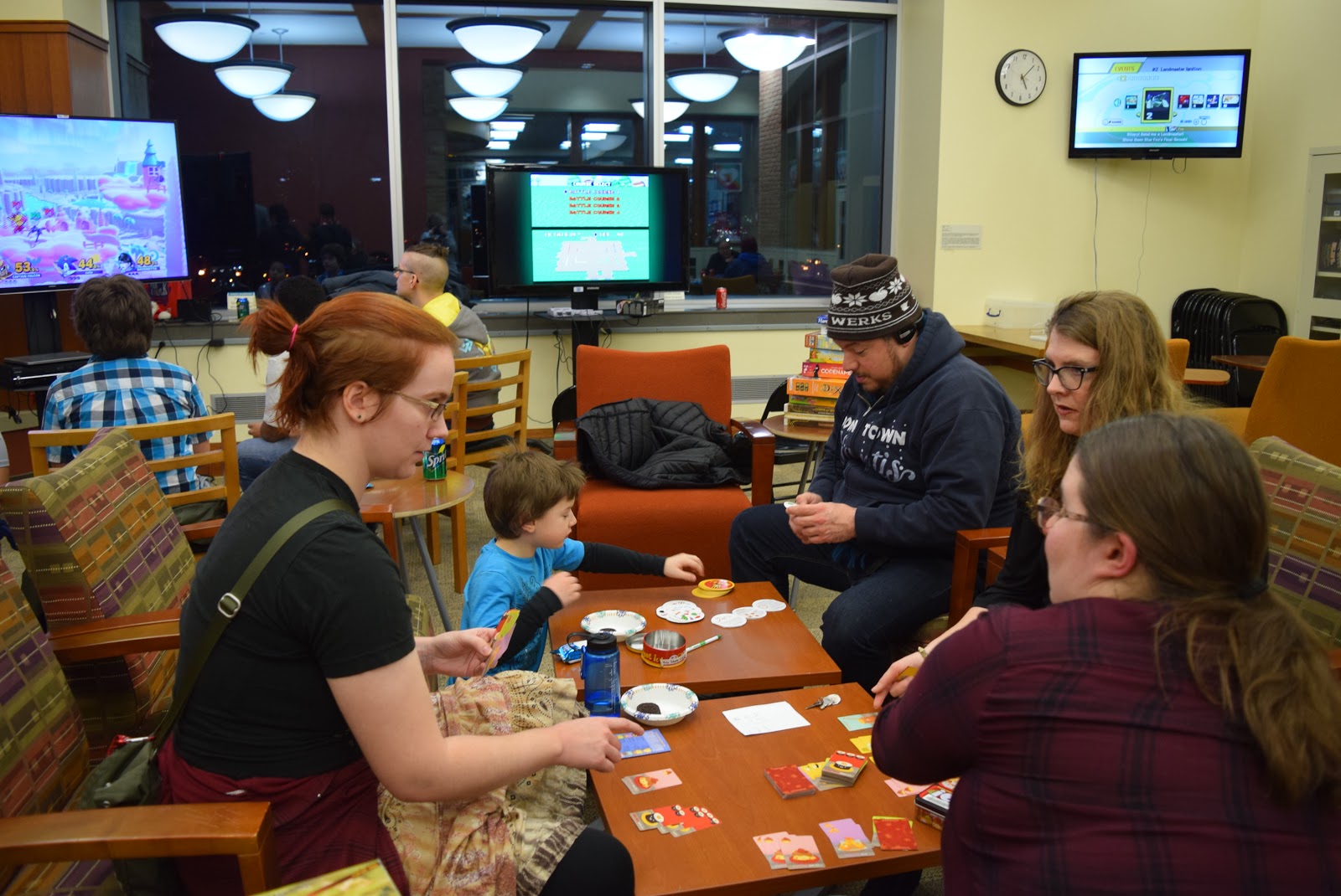 Metro State student Samara Garrett, left, plays the card game “Sushi Go!” with librarian Jennifer DeJonghe. (Margot M. Barry / The Metropolitan)