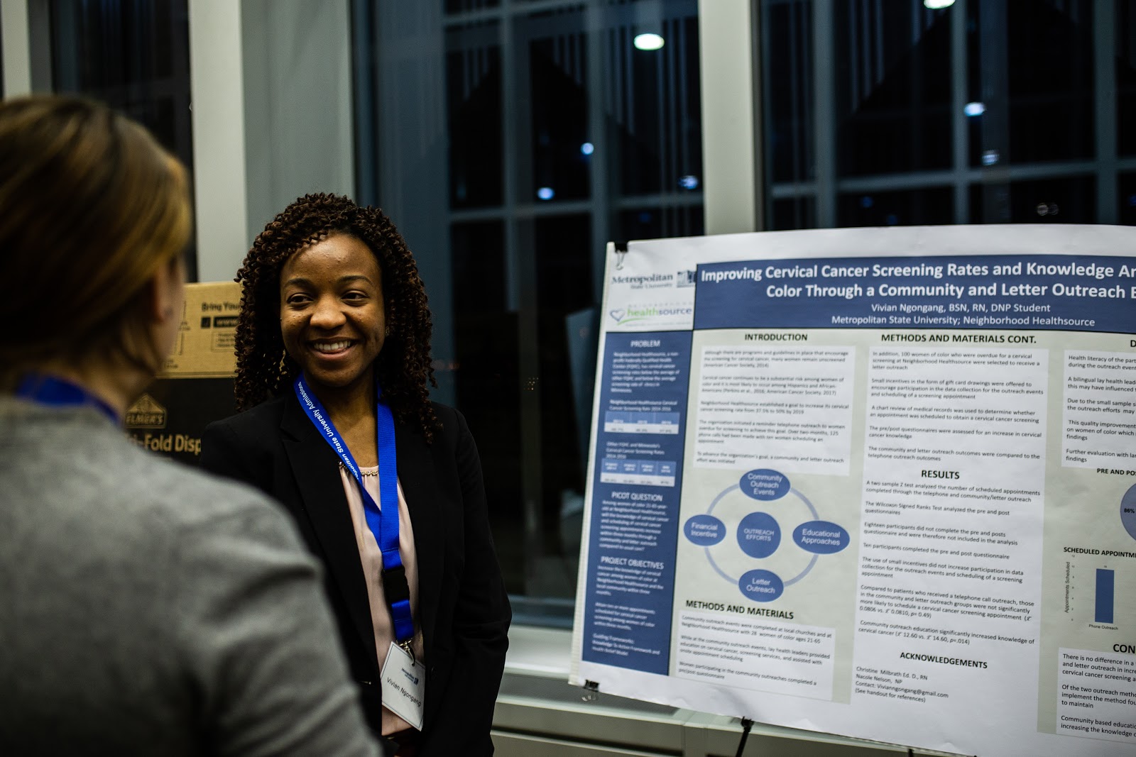 Doctoral nursing student Vivian Ngongang answers questions about her investigation into improving cervical cancer screening rates among women of color. Photo by Eli Bartz