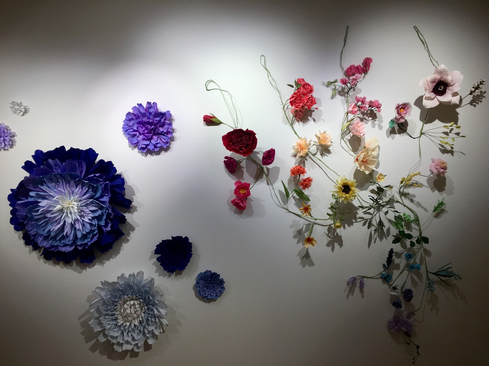 Dawn Cramer’s paper flowers in the 2019 Student Salon in the Gordon Parks Gallery, Metropolitan State University Library and Learning Center, 645 E. Seventh St., St. Paul. Her work is also on view in “Botanicals” through March 30 at the St. Croix Galleries of ArtReach St. Croix, 224 N. Fourth St., Stillwater.  (Photo by Kathryn Ganfield / The Metropolitan)