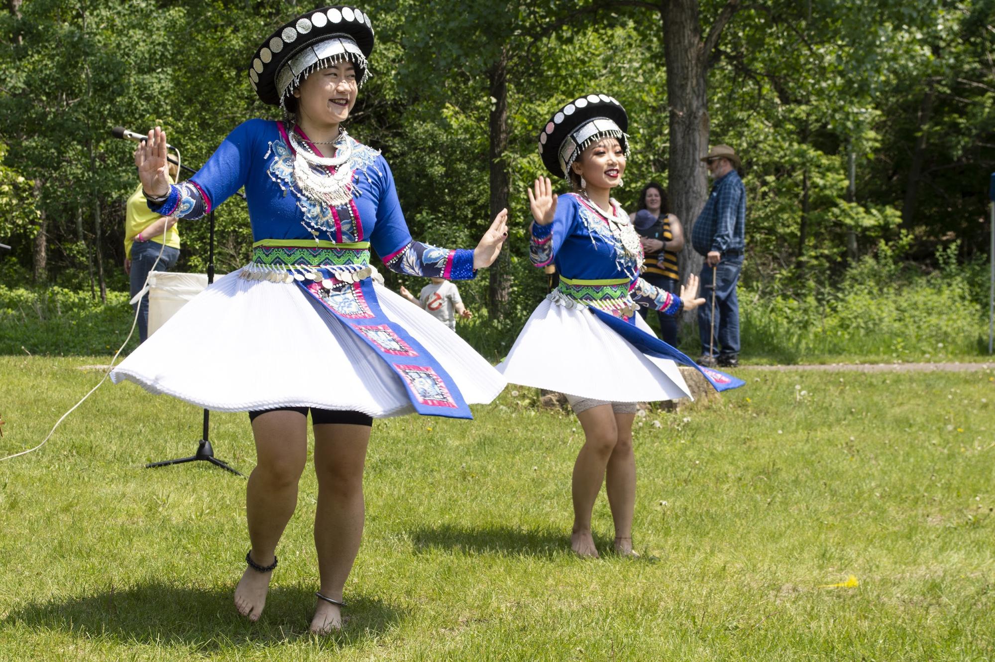 You Lee, left, and Nkauj Sheng dance in traditional Hmong style. They are co-founders of St. Paul’s YeS Dance Academy. (Mandy Hathaway / The Metropolitan)